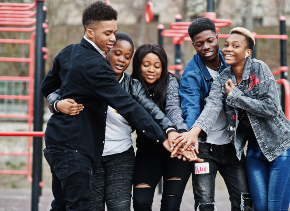 Young millennials african friends on outdoor gym. Happy black people having fun together. Generation Z friendship concept.
